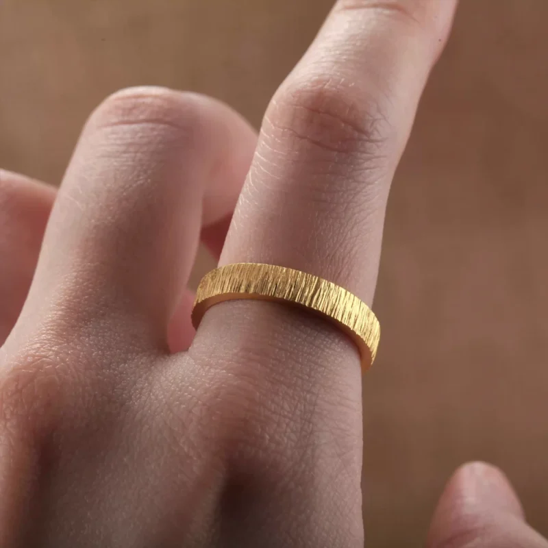textured 24k gold rings, minimalist gold wedding bands, hand-forged pure gold bands