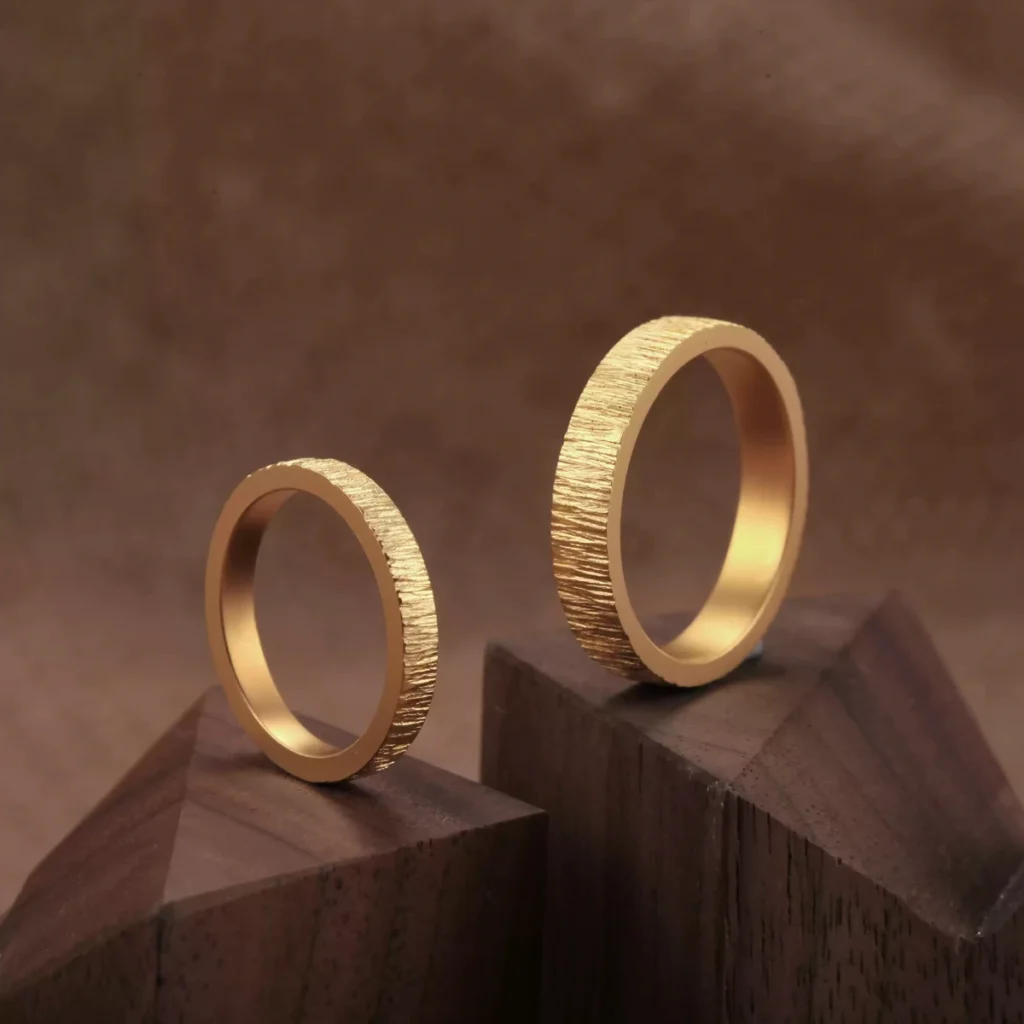 textured 24k gold rings, minimalist gold wedding bands, hand-forged pure gold bands