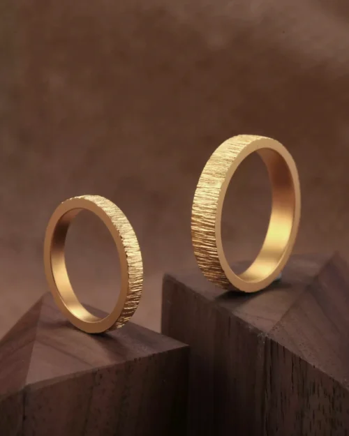 textured 24k gold rings, minimalist gold wedding bands, hand-forged pure gold bands