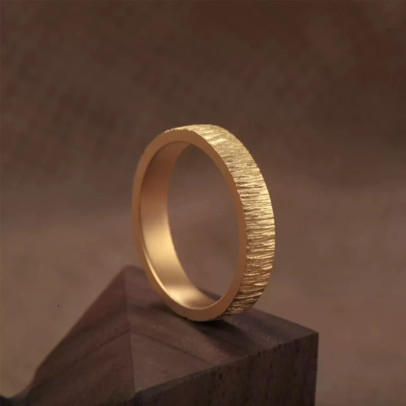 textured 24k gold rings, minimalist gold wedding bands, hand-forged pure gold bands