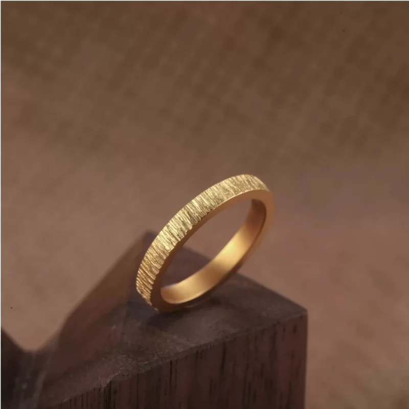 textured 24k gold rings, minimalist gold wedding bands, hand-forged pure gold bands
