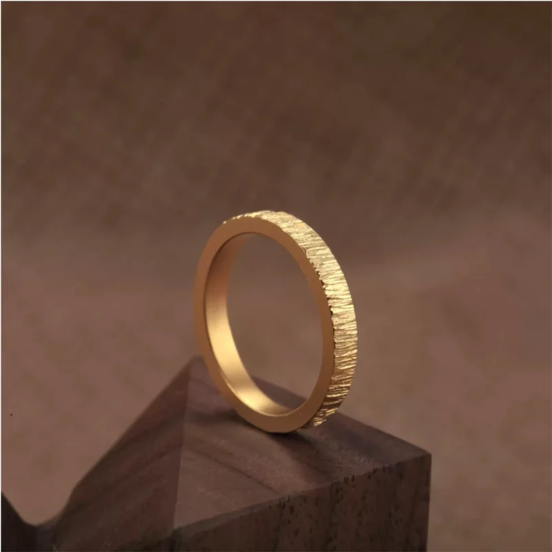 textured 24k gold rings, minimalist gold wedding bands, hand-forged pure gold bands