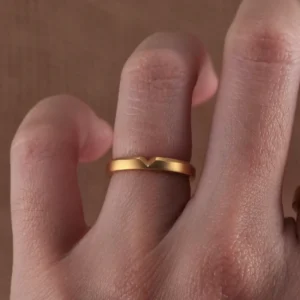 Mastering Gold: The Art and Craftsmanship Behind 24K Gold Jewelry 1 couple wedding rings, 24k gold wedding bands, heart cut gold ring, hand-forged couple rings, solid gold love bands