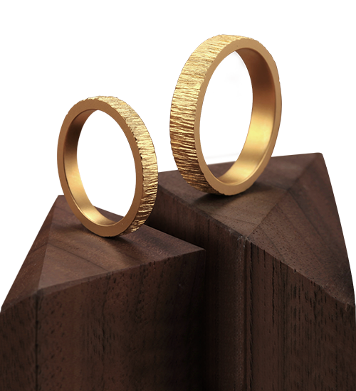 textured 24k gold rings, minimalist gold wedding bands, hand-forged pure gold bands