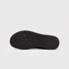 chunky sole leather casual sneakers in black, outsole tread view on a light gray background
