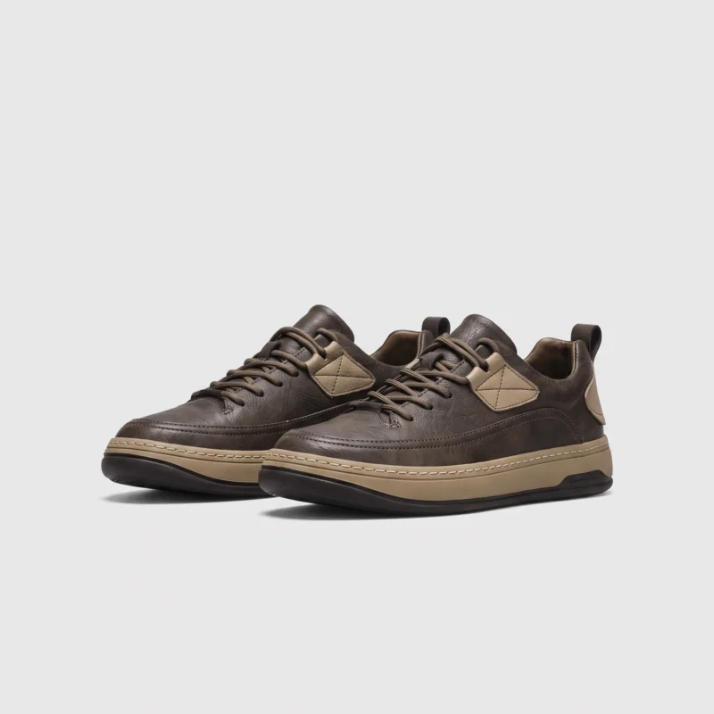 chunky sole leather casual sneakers in brown, front 45-degree view of the pair on a light gray background