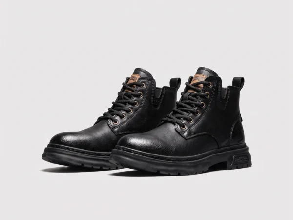 chunky sole leather ankle boots in black, front 45-degree view of the pair on a light gray background