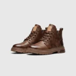 chunky sole leather ankle boots in brown, front 45-degree view of the pair on a light gray background
