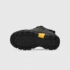 leather outdoor hiking sneakers in black, outsole tread view on a light gray background