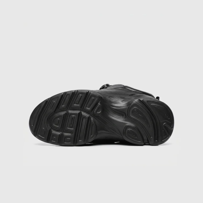 lightweight boa walking sneakers in black, outsole tread view on a light gray background