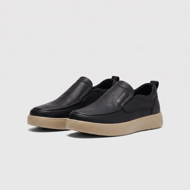 slip-on leather casual shoes in black, front 45-degree view of the pair on a light gray background
