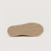 slip-on leather casual shoes in black, outsole tread view on a light gray background
