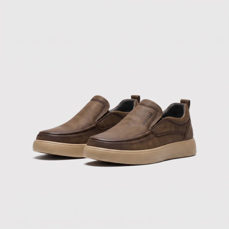 slip-on leather casual shoes in khaki, front 45-degree view of the pair on a light gray background