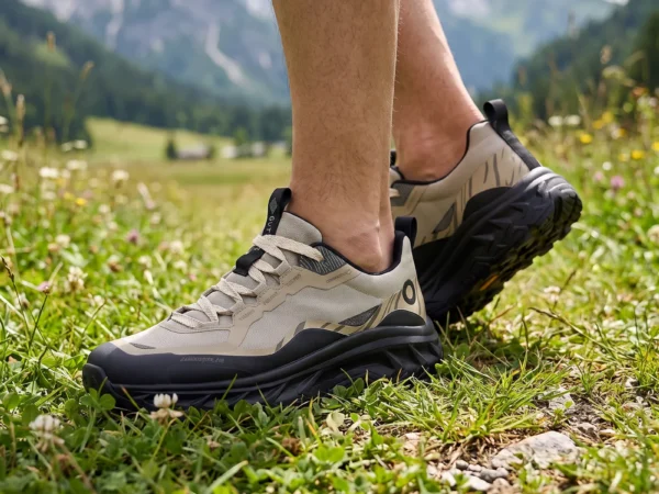 mens breathable chunky trail sneakers - lightweight hiking casual walking shoes in khaki, worn on foot on a mountain meadow, soft daylight lifestyle photo