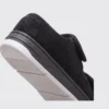 Close-up of the heel and elastic strap detail of black AZEKA linen sandals