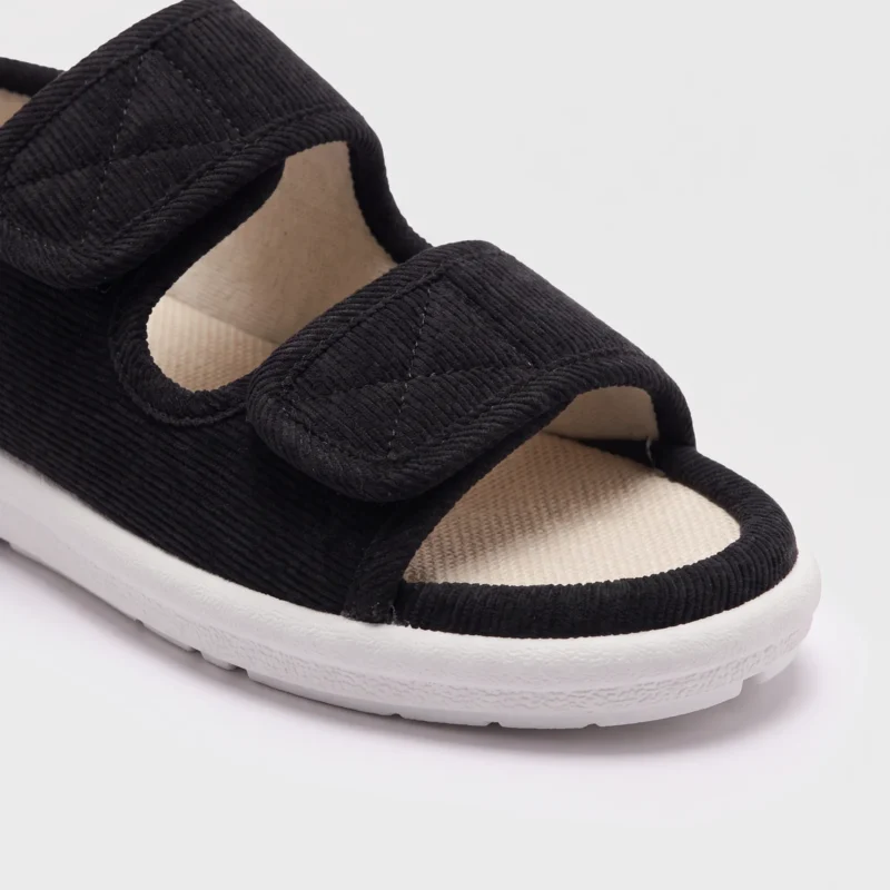Close-up of the open toe and front strap of black AZEKA adjustable strap linen sandals