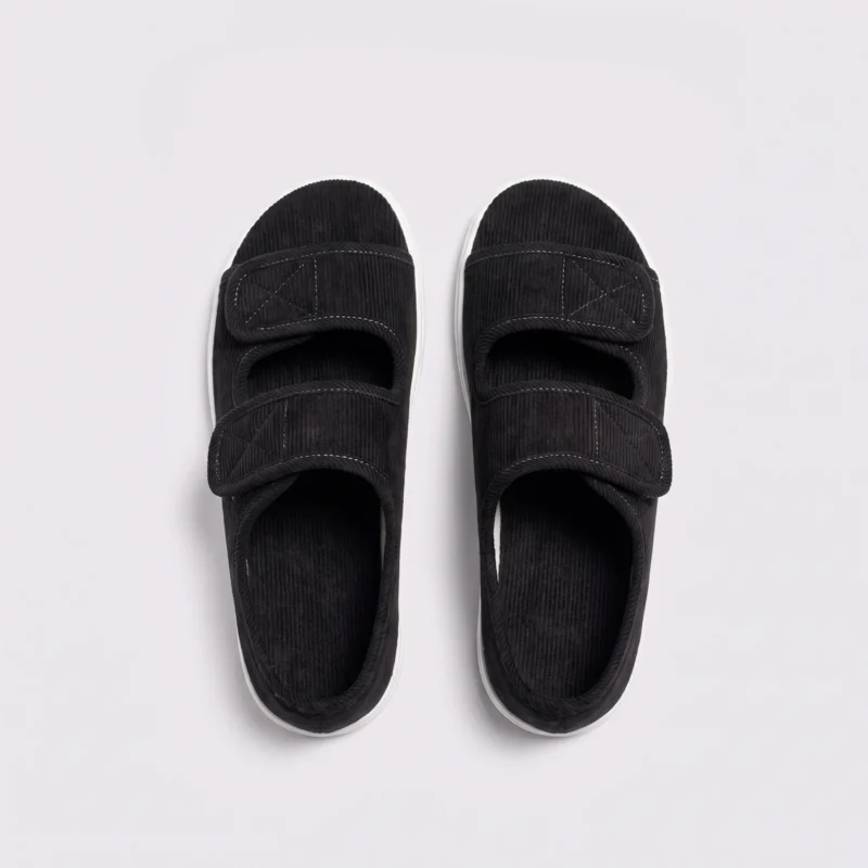 Top view of a pair of black AZEKA adjustable strap linen sandals showing two hook-and-loop straps and linen footbed