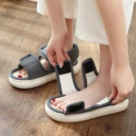 Pair of blue AZEKA adjustable strap linen sandals, front 45 degree view, thick cushioned sole on light gray background