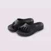 toe separator arch support slide sandals for women - open-toe cushioned platform in black, front 45-degree view of the pair on a light gray background