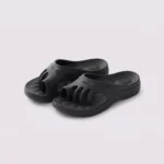 toe separator arch support slide sandals for women - open-toe cushioned platform in black, front 45-degree view of the pair on a light gray background
