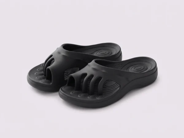 toe separator arch support slide sandals for women - open-toe cushioned platform in black, front 45-degree view of the pair on a light gray background