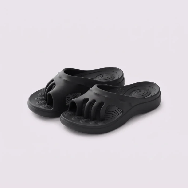 toe separator arch support slide sandals for women - open-toe cushioned platform in black, front 45-degree view of the pair on a light gray background