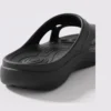 toe separator arch support slide sandals for women - open-toe cushioned platform in black, close-up view of the heel on a light gray background