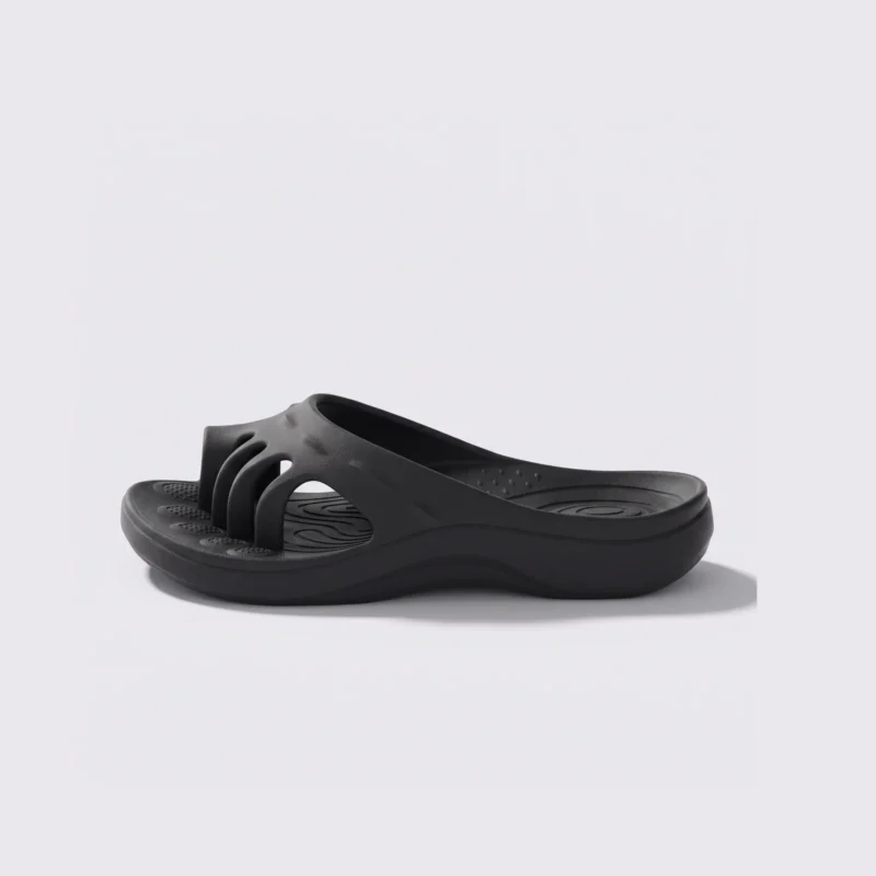 toe separator arch support slide sandals for women - open-toe cushioned platform in black, left side profile view on a light gray background