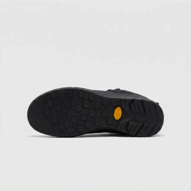 Grippy lugged outsole of black trail running shoes