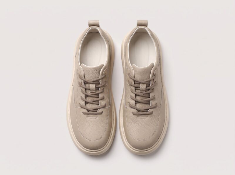 Beige menu2019s leather casual sneakers top view showing laces and padded collar