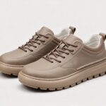 Menu2019s leather casual sneakers in gray, front 45 degree view