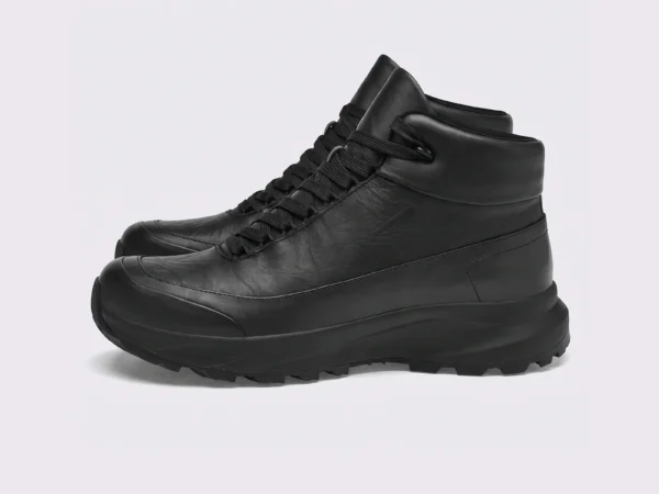 Black high-top leather boots, left side profile view