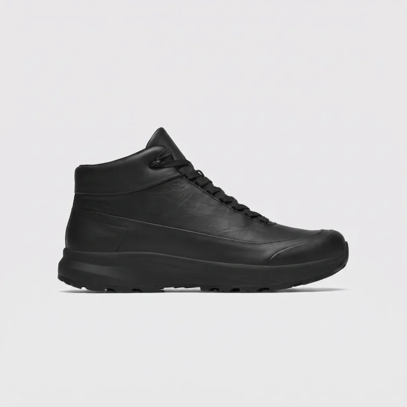 Black high-top leather boots, right side profile view