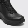 Toe detail of the black high-top leather boots showing the top-grain leather upper