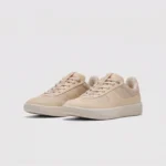 Retro German trainer sneakers in beige, front 45 degree view