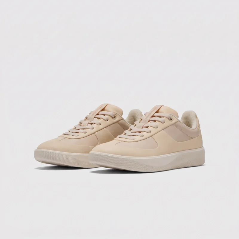 Retro German trainer sneakers in beige, front 45 degree view