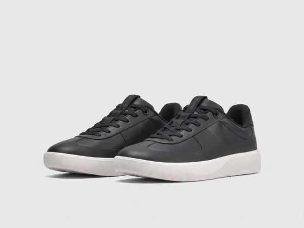 Retro German trainer sneakers in black, front 45 degree view