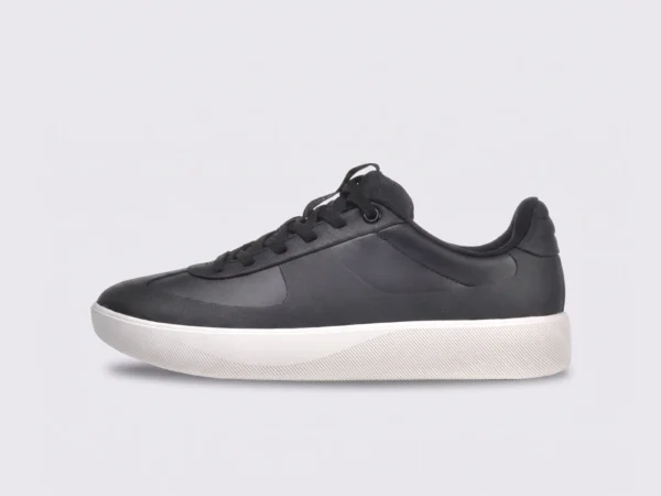 Retro German trainer sneakers in black, left side profile view