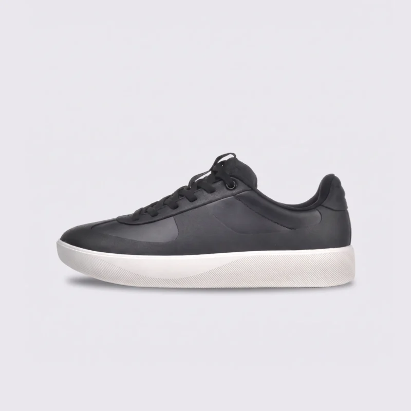 Retro German trainer sneakers in black, left side profile view