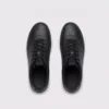 Top view of a pair of retro German trainer sneakers in black