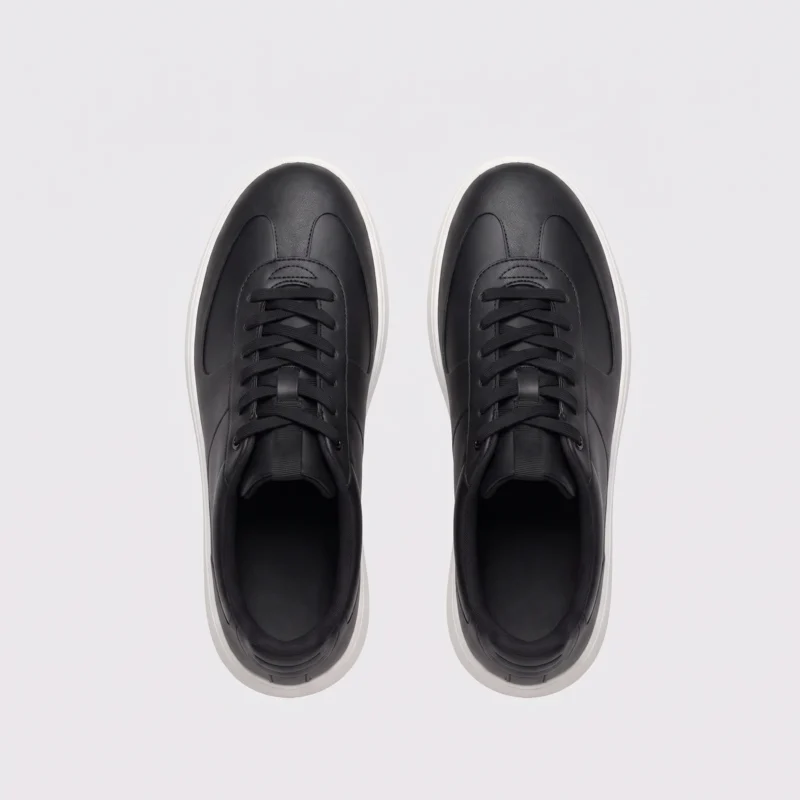 Top view of a pair of retro German trainer sneakers in black