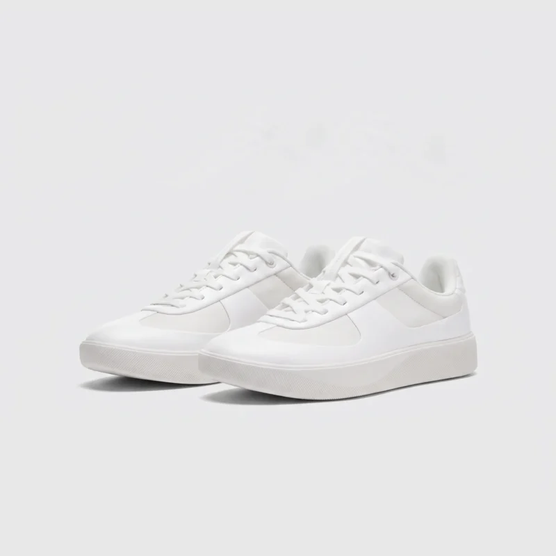 Retro German trainer sneakers in classic white, front 45 degree view
