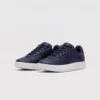 Retro German trainer sneakers in navy, front 45 degree view
