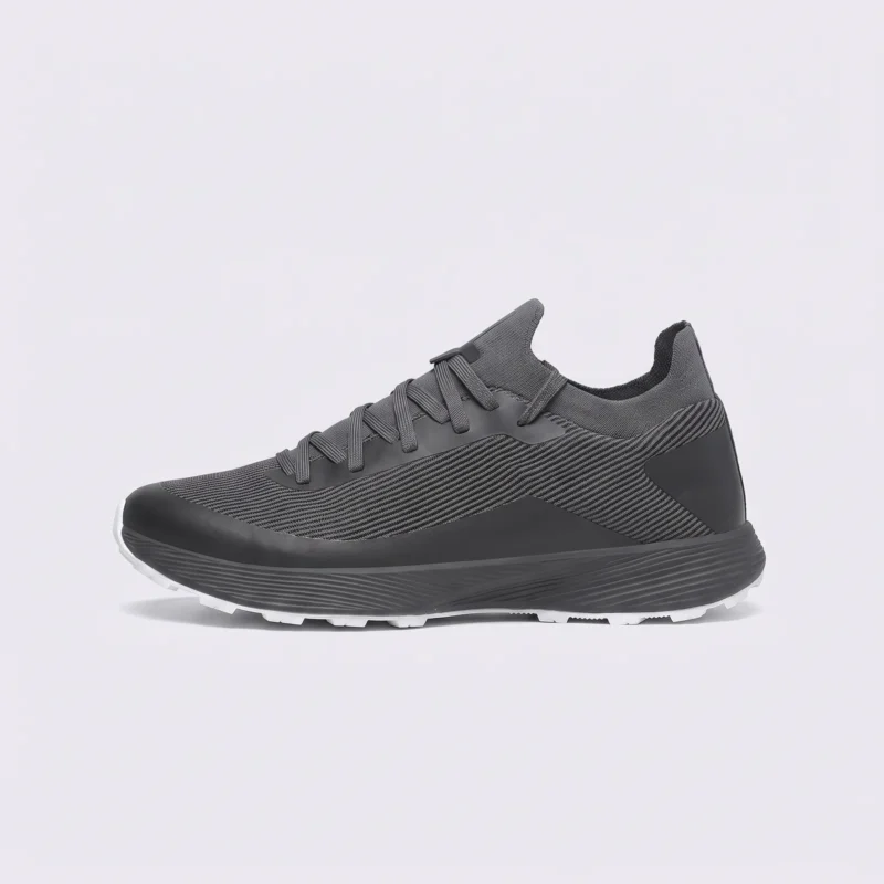 lightweight trail running sneakers in gray, left side profile view on a light gray background