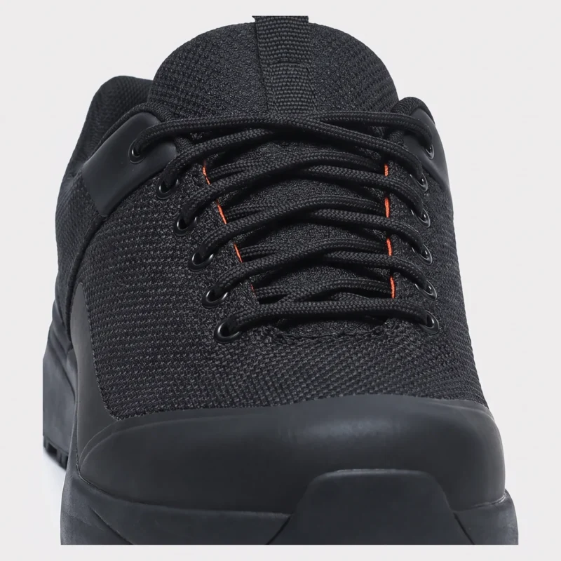 Closure detail of black waterproof trail running shoes showing lacing system