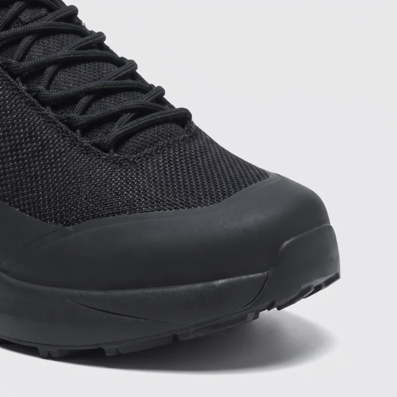Toe detail of black waterproof trail running shoes showing protective toe cap