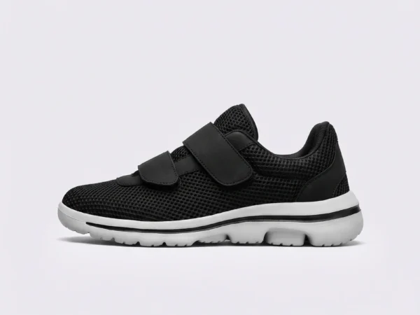 Side profile of black breathable wide fit walking shoes with double hook-and-loop straps