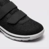 Roomy wide toe box with breathable mesh of black walking shoes, close-up