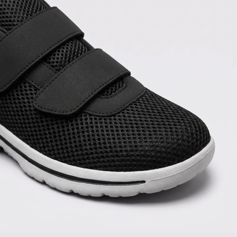 Roomy wide toe box with breathable mesh of black walking shoes, close-up