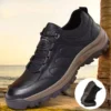 british style leather outdoor hiking shoes casual anti-slip sneakers in black, front 45-degree view of the pair on a light gray background